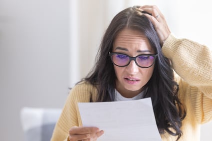 stressed-woman-from-reminder-because-she-forgot-pay-energy-mortgage-insurance-invoice